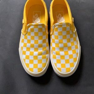 Checkered Vans slip ons